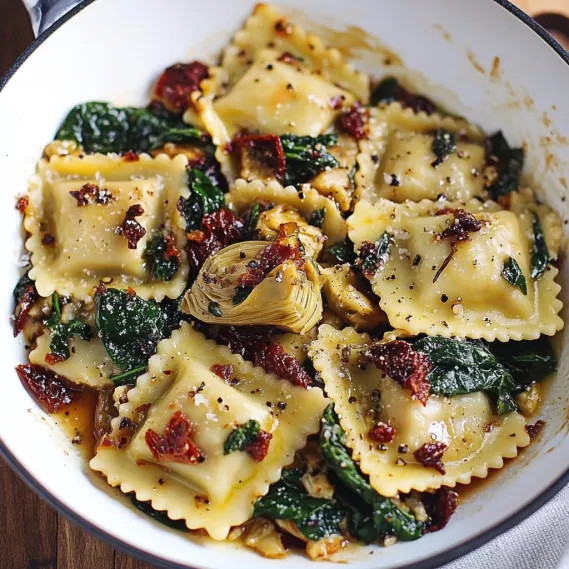 A bowl of pasta with vegetables.