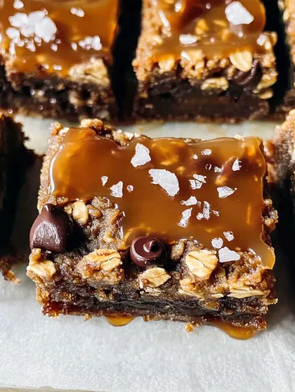 A piece of chocolate and caramel covered cake.