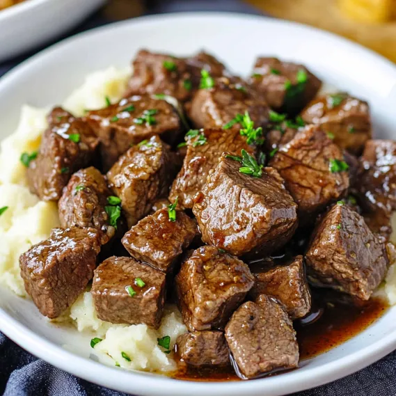A plate of meat and potatoes.