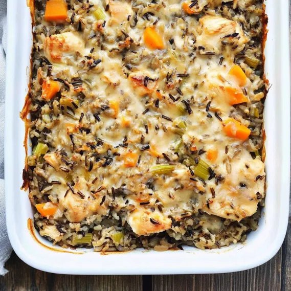 A white plate with a casserole dish on it.