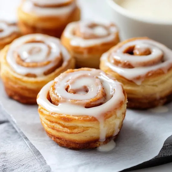 A plate of pastries with frosting.