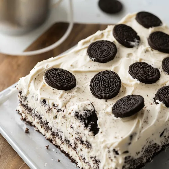 A slice of cake with chocolate and white frosting.