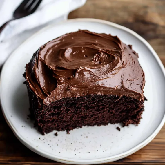 A slice of chocolate cake on a plate.