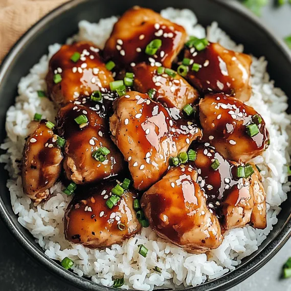 A bowl of chicken with rice.